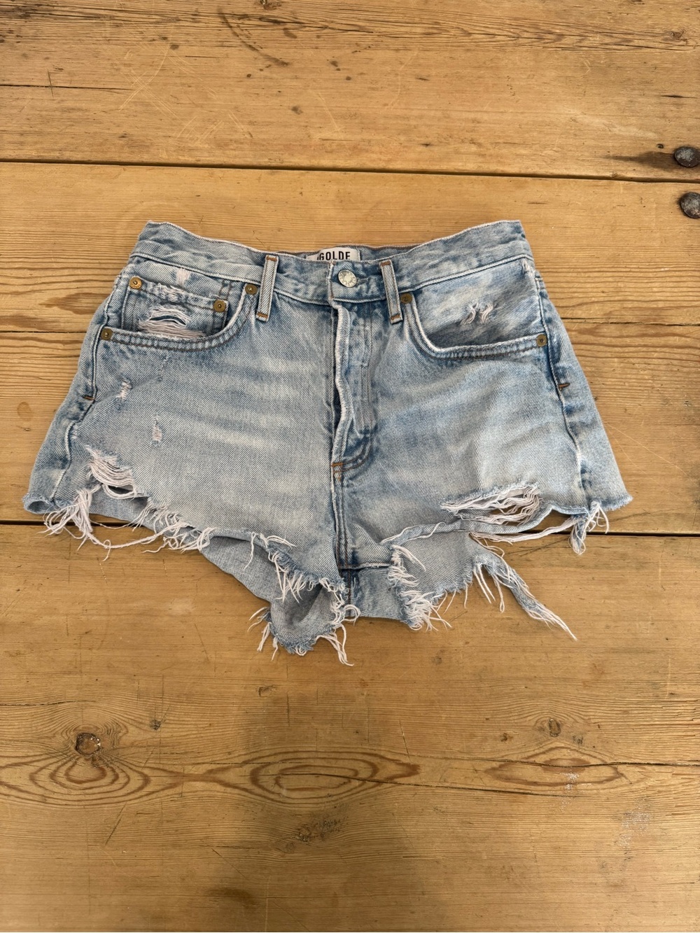 Agolde light wash Parker shorts in size 25